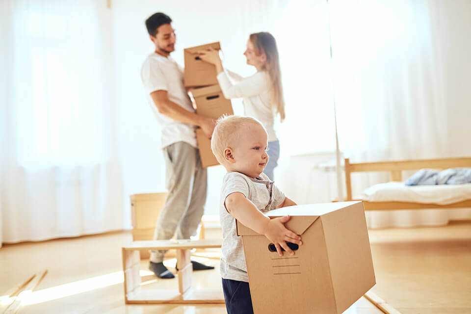 A baby with a box