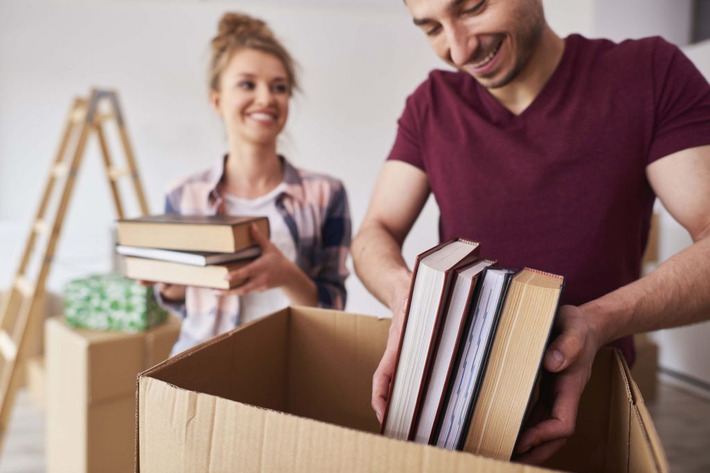 Man and woman packing publications in the package