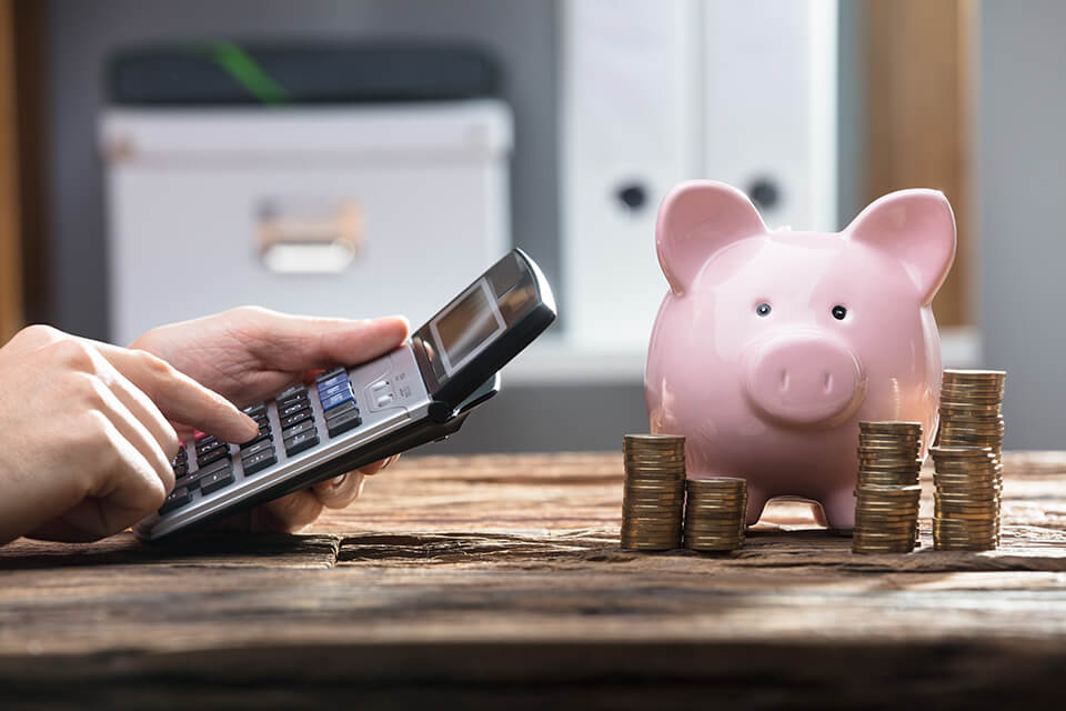 Calculator and a piggy bank