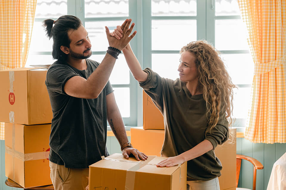 A couple is happy about hiring a moving company in Chicago to assist them