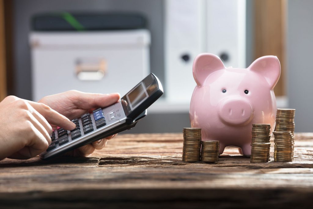 Calculator and a piggy bank