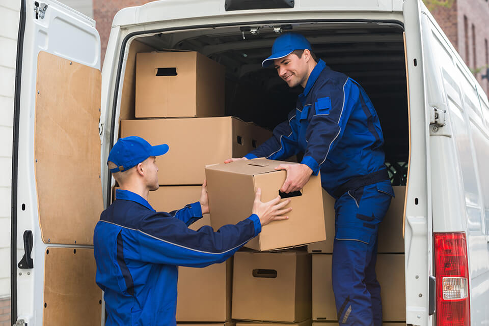 Two local movers in Chicago loading a truck