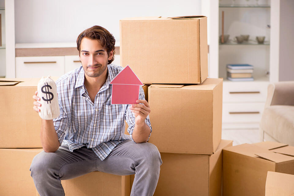 A man in front of his boxes