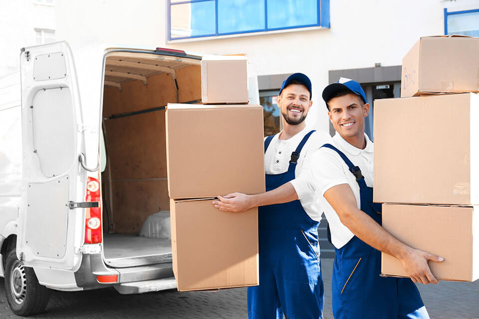 Professional movers in Chicago taking out boxes from their truck