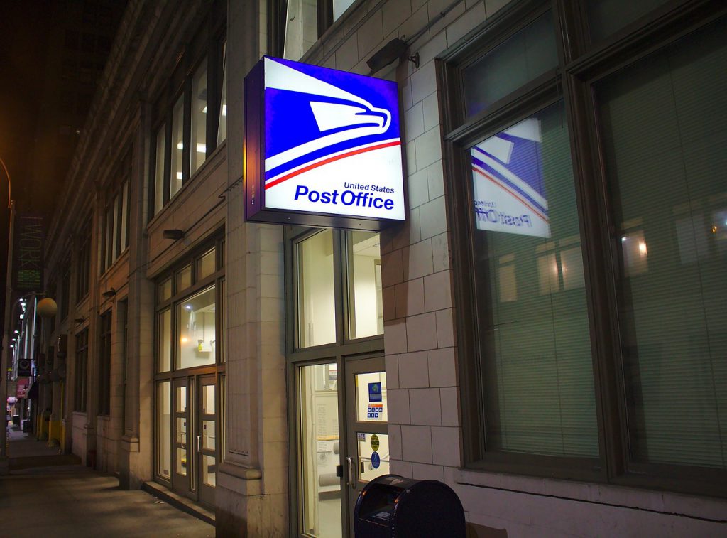 A USPS office, pictured at night