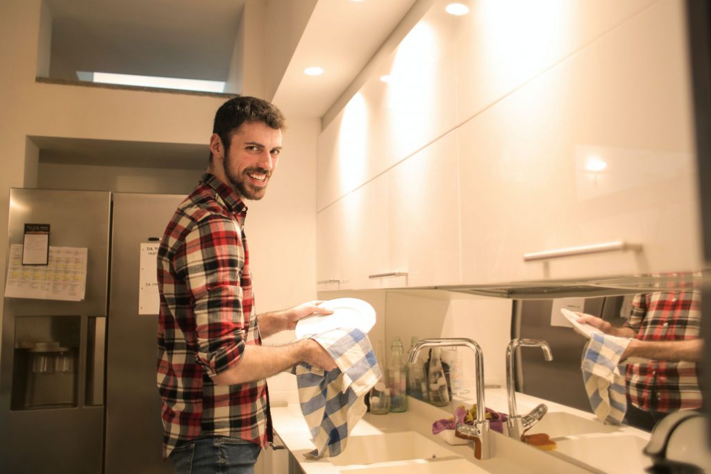 Man washing dishes