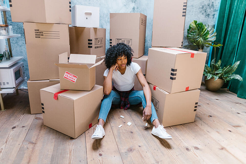 A girl about to unpack boxes local movers in Chicago left
