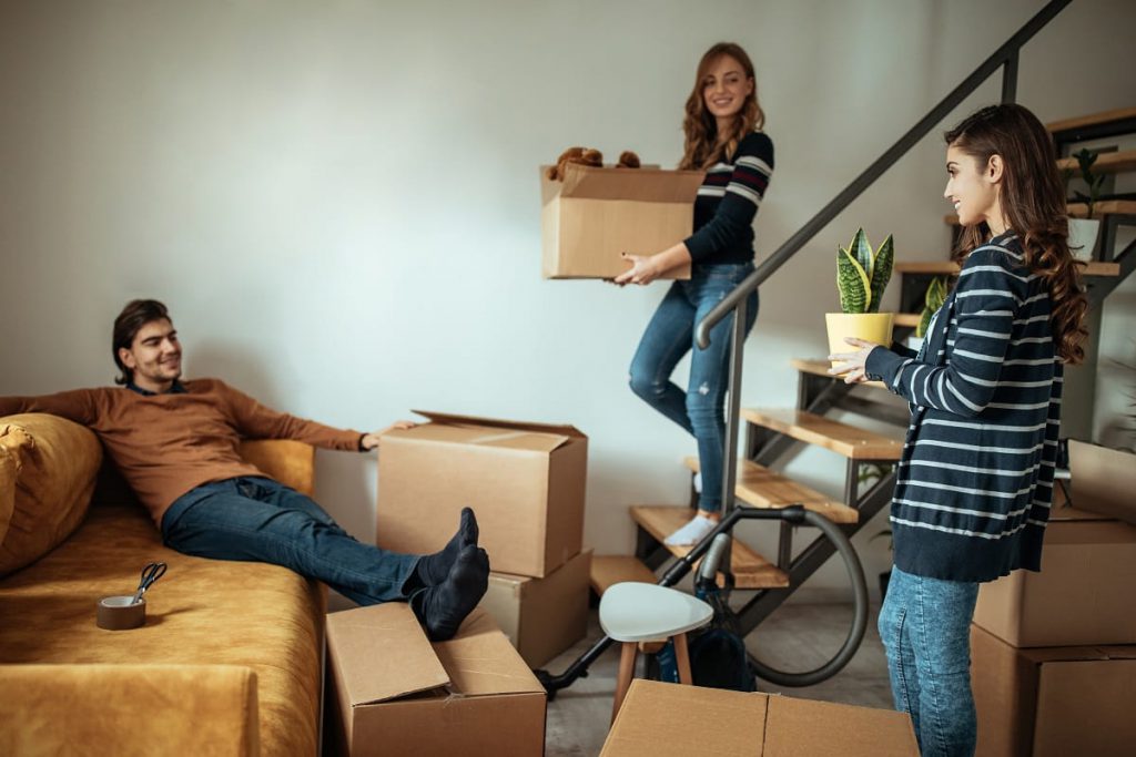 People unpacking after relocating with professional Chicago movers