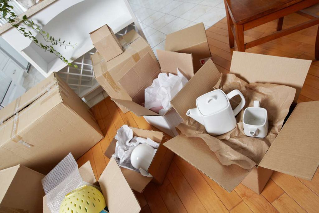 Boxes with fragile items ready to be packed by a moving company in Chicago