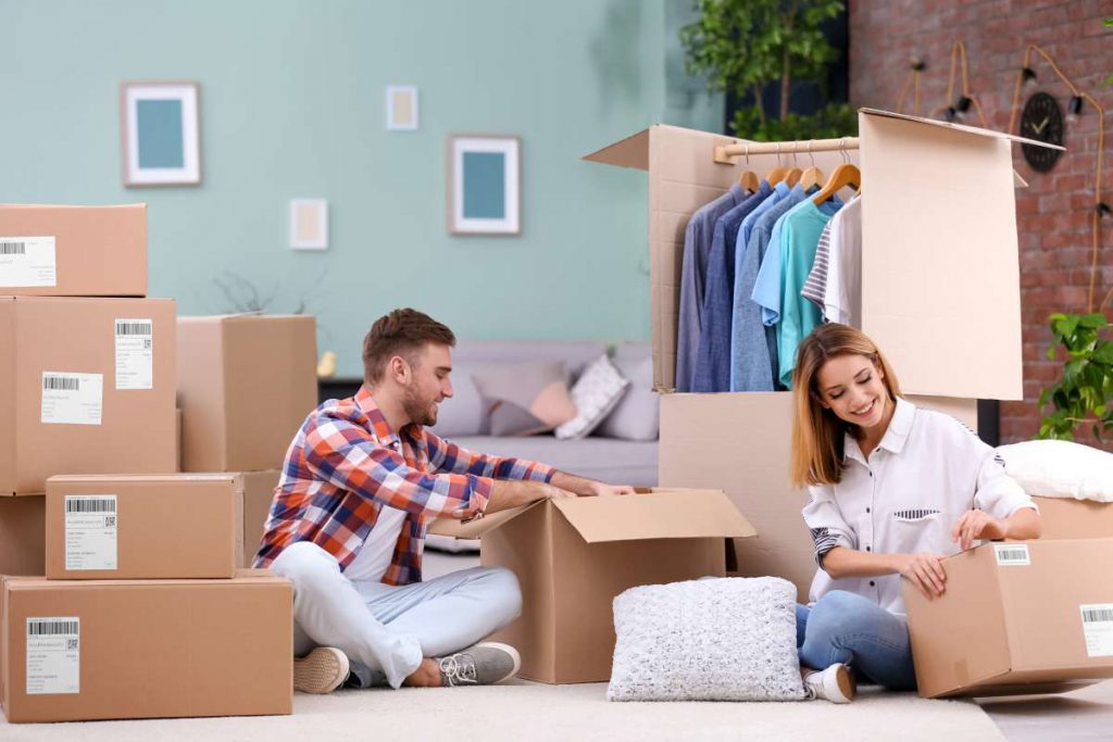 A young couple packaging clothes