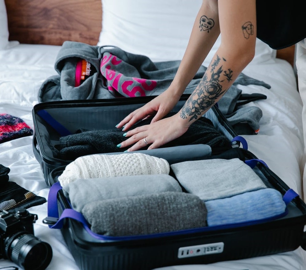 Packing clothes inside a suitcase