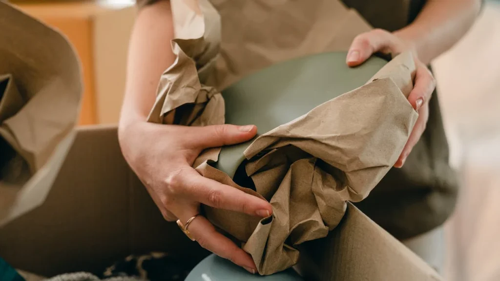 woman wrapping item